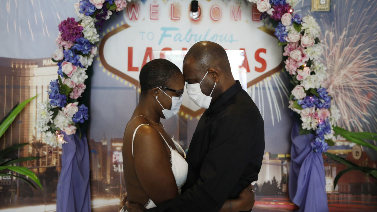 Using Face Masks and Sanitizer, Couples Say 'I Do' in Vegas