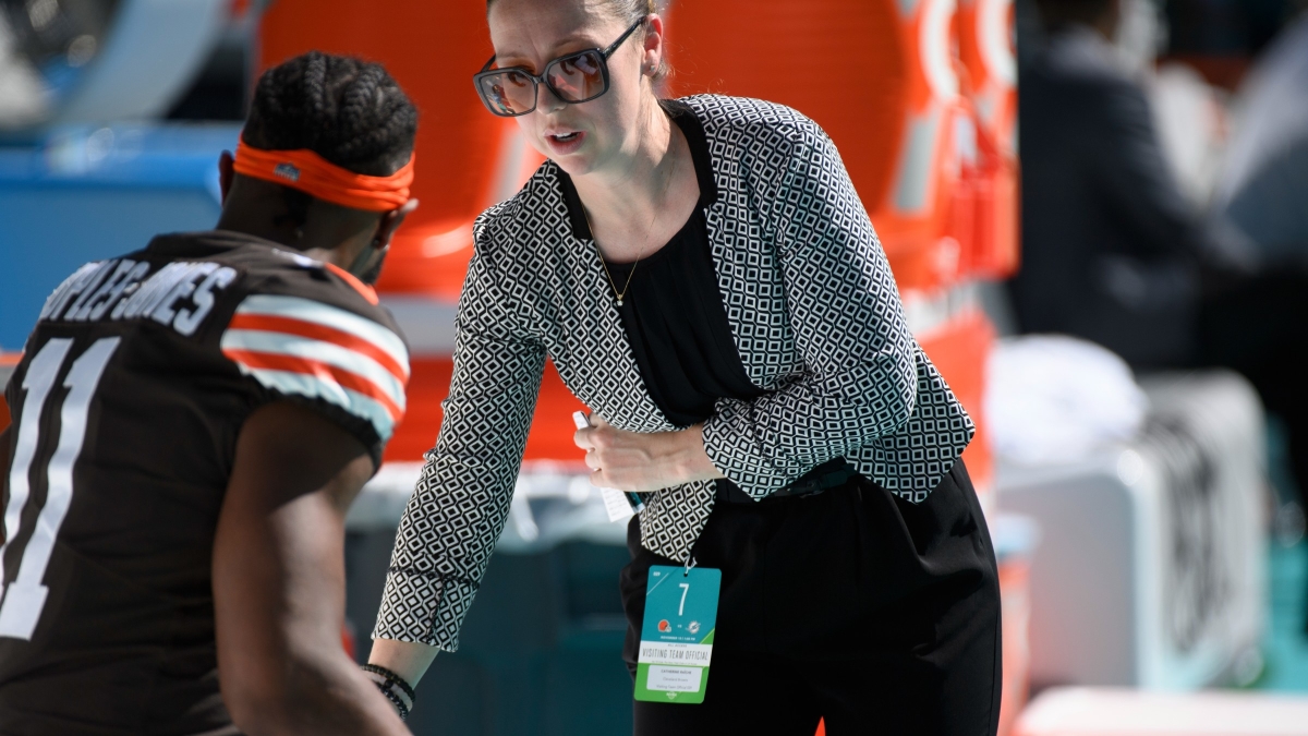 Cleveland Browns assistant general manager & vice president of Football Operations Catherine Raiche talks with Cleveland Browns wide receiver Donovan Peoples-Jones (11) on the sidelines before an NFL football game.